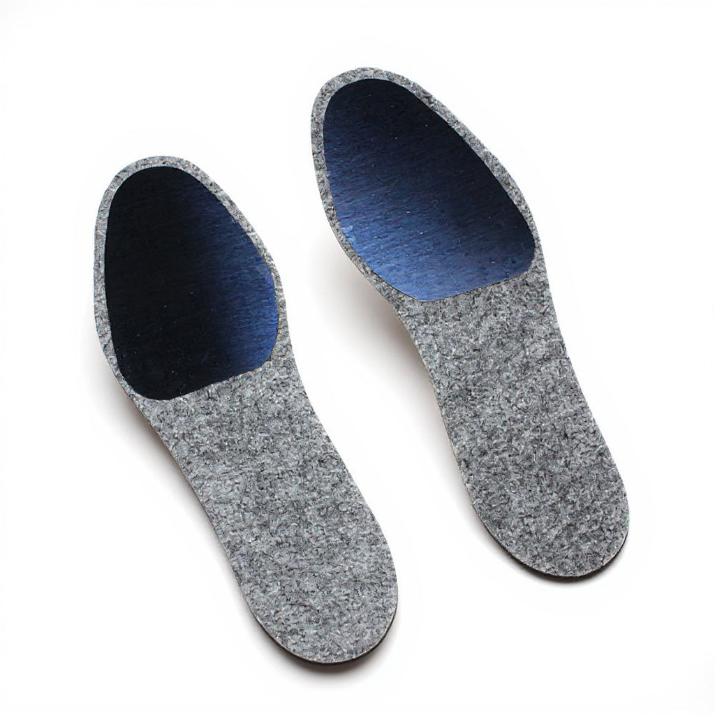 Dr. Jill's Turf Steel Insole Half — pair of grey heathered-felt half insoles with navy brushed-steel forefoot plate, three-quarter angled view on white